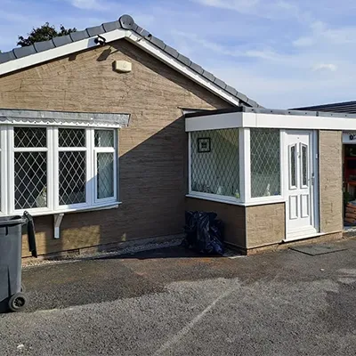 a house with a car parked in front of it